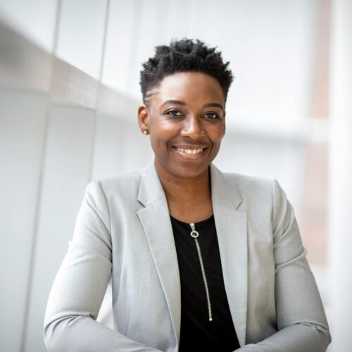Woman Wearing Gray Notch Lapel Suit Jacket