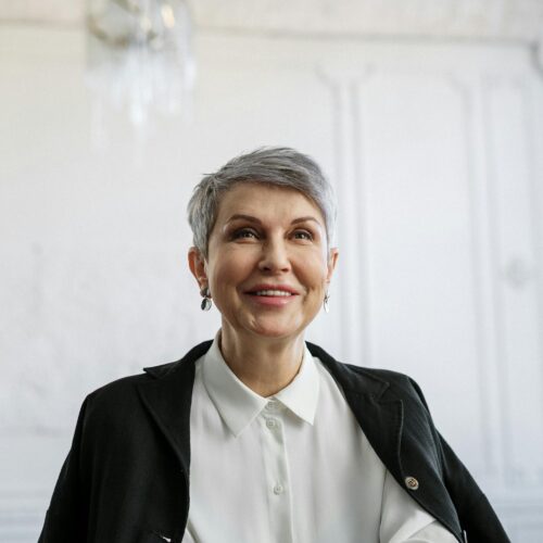 Smiling Woman in Black Blazer