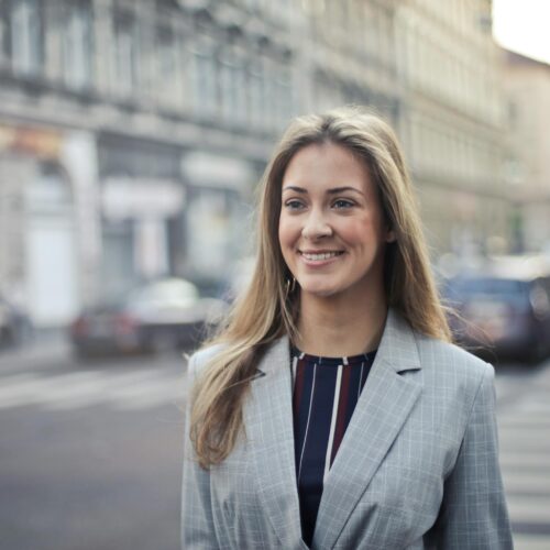 Close-up Photography of a Woman Wearing Formal Coat